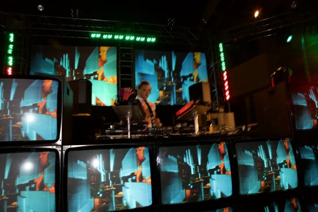 Electronic Dance Concert with a DJ and Monitors