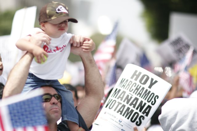 Father and Child with Protest Sign