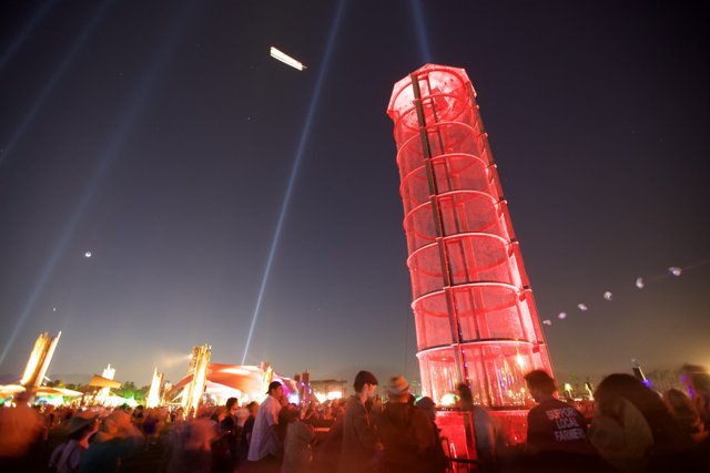 The Red Tower Illuminates the Night Sky
