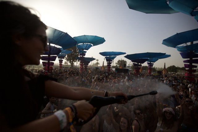 Water Spraying Woman at Coachella Music Festival