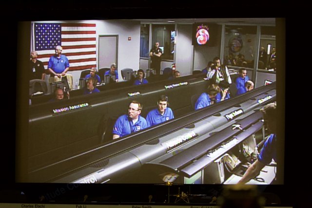 People in Space Station on Large Screen