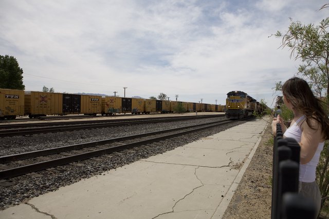 Young Girl Watches Union Pacific Freight Train Pass