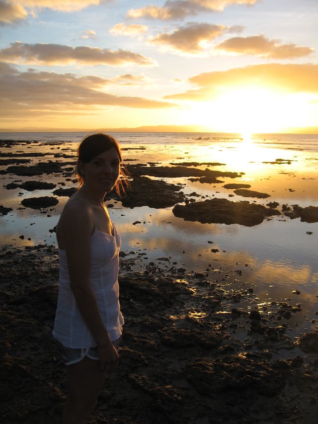 Golden Sunset Silhouette on Fiji's Rocky Shore