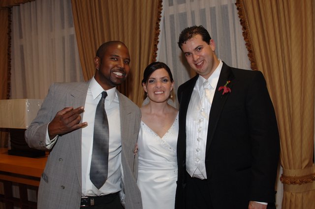 Joyful Wedding Celebration with Bride, Groom, and Guest