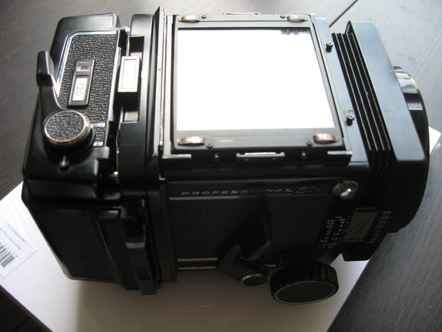 Black Camera on a White Surface