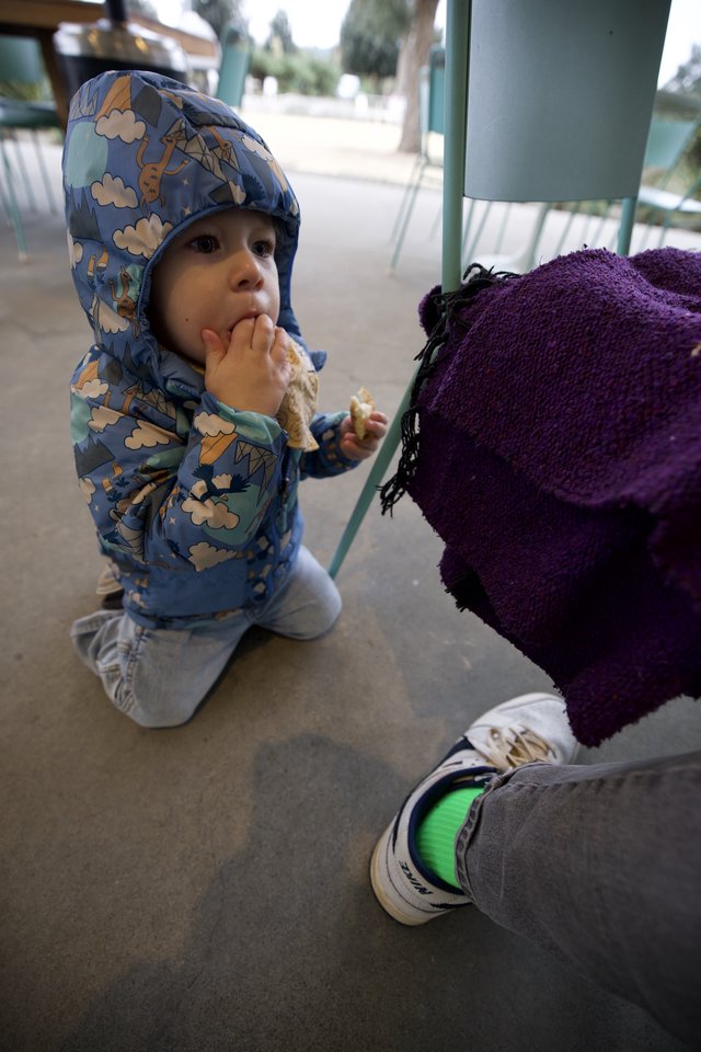 Toddler Enjoying Ice Cream at Outdoor Cafe