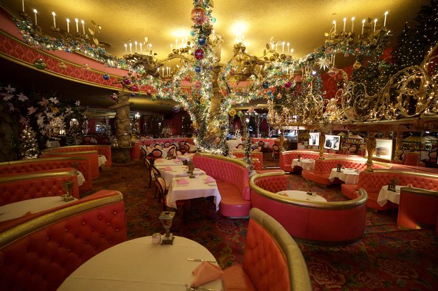 Opulent Crystal Chandelier in Lavish Pink Restaurant Interior