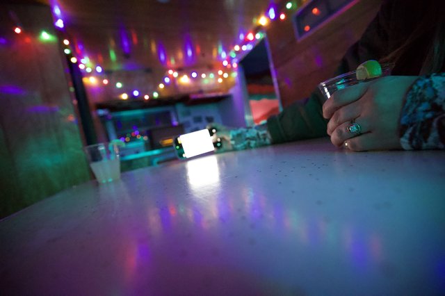 Festive Evening at a Colorfully Lit Bar
