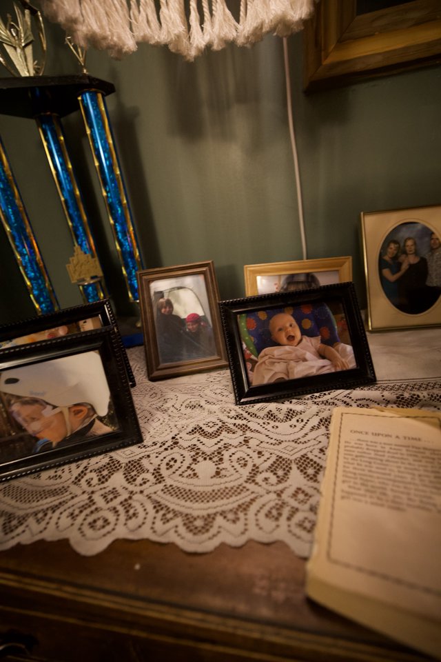 Cherished Memories: Family Trophy and Photo Display