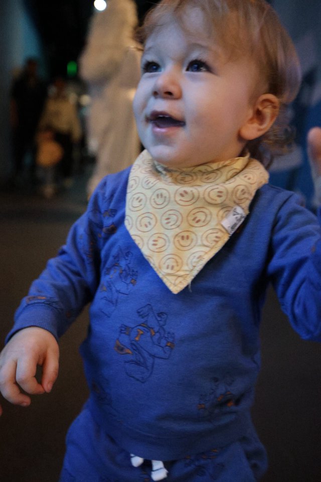 Toddler in Blue Shirt with Smiley Face Bandana