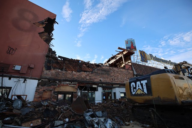 Tornado Destruction Site with CAT Excavator and Debris