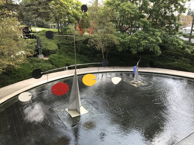 Colorful Sculpture in the Middle of a Pond