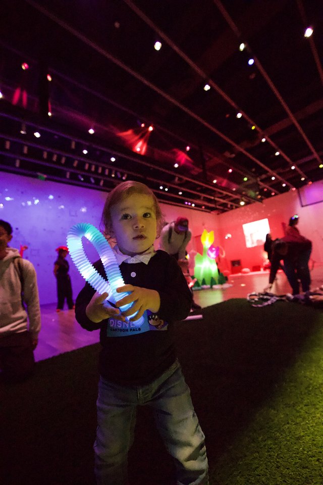 Child with Light Toy at Baby Rave Event