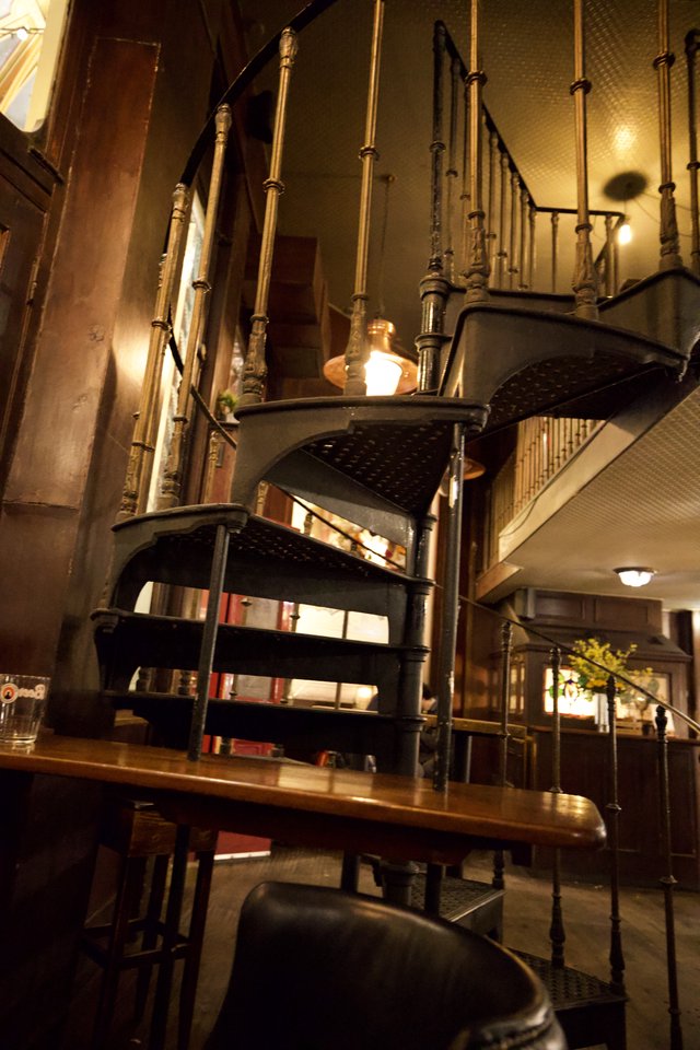 Atmospheric Interior of Historic London Bookshop with Spiral Staircase