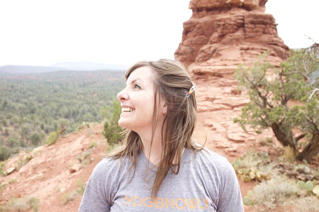 Joyful Woman Gazing Up at Sedona Red Rocks