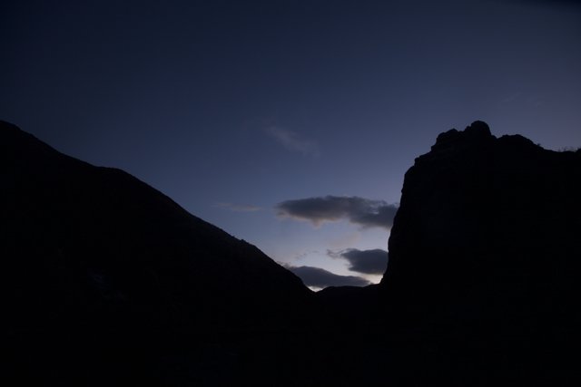 Mountain Silhouette Over Sunset Sky