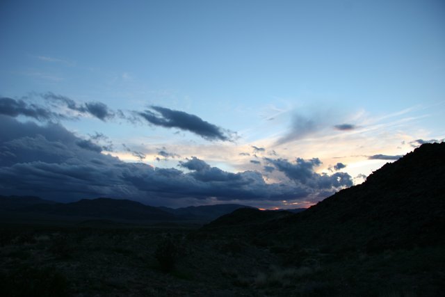 Desert Sunset With Majestic Mountain Range
