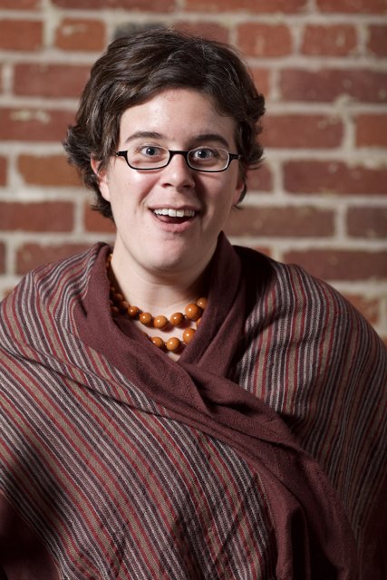 Happy Portrait of a Woman with Glasses and a Scarf