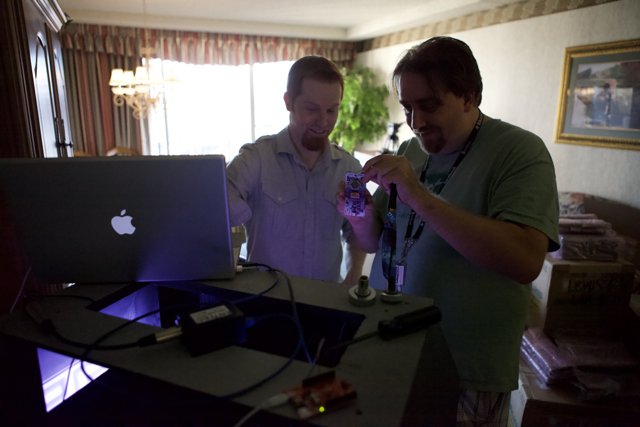 Two Men Working on Laptops