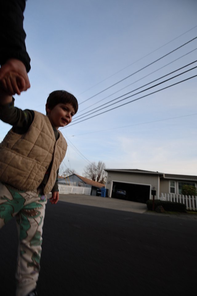 Low Angle Portrait of Child in Suburban Street