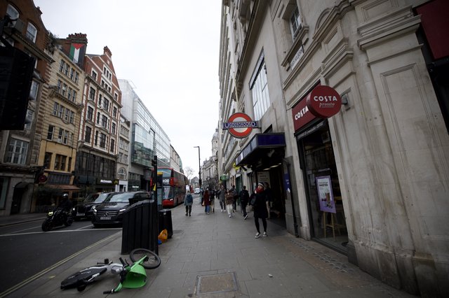 Urban Street Scene with Fallen Lime Bike in London