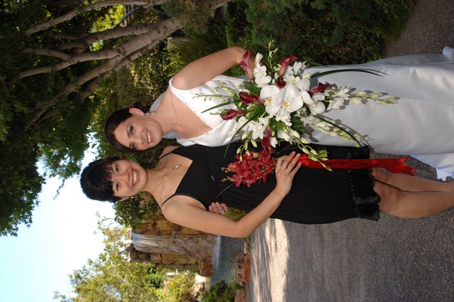 Bride and Bridesmaid Celebrate at Garden Wedding