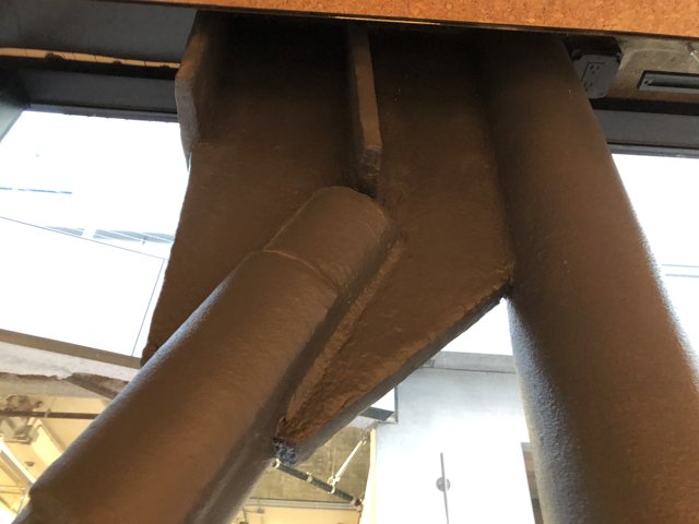 A Rusty Metal Pipe with Attached Pipe