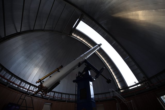 Telescope Observatory Interior with Dramatic Skylight
