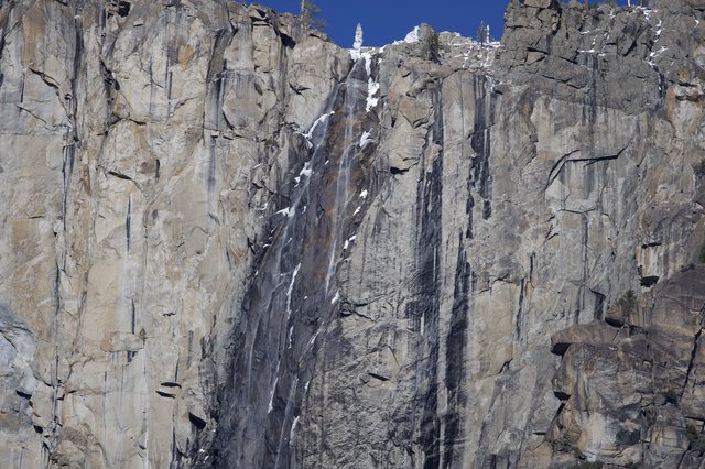 Dramatic Ice-Streaked Granite Cliff Face in Yosemite