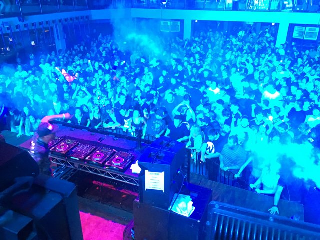 Blue-Lit Nightclub Crowd Gets Pumped