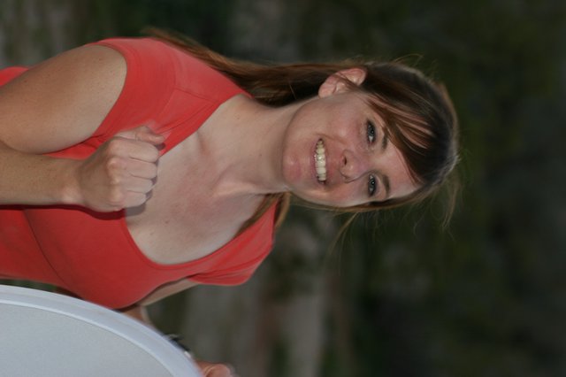 Joyful Young Woman in Red Top Outdoors