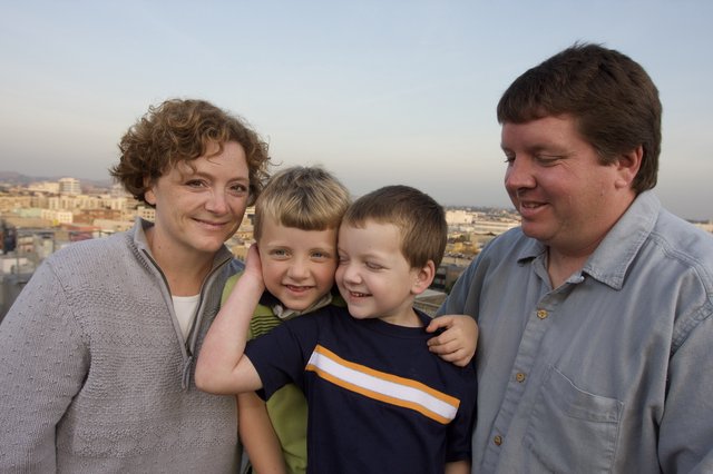 Family Portrait on Urban Rooftop at Dusk