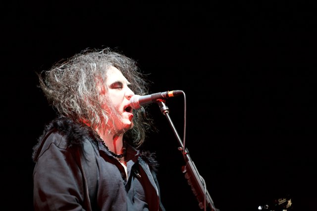 Robert Smith performs at The Cure concert