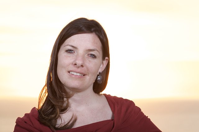 Golden Hour Portrait of a Smiling Woman at Sunset