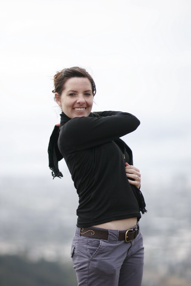 Windswept Woman Smiling Atop San Francisco Overlook