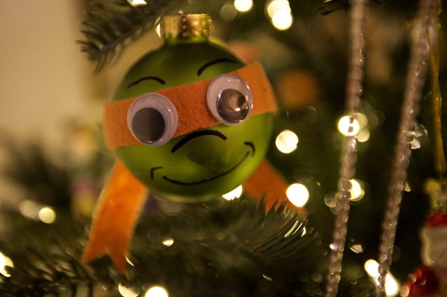 Festive Green Christmas Ornament with Orange Scarf
