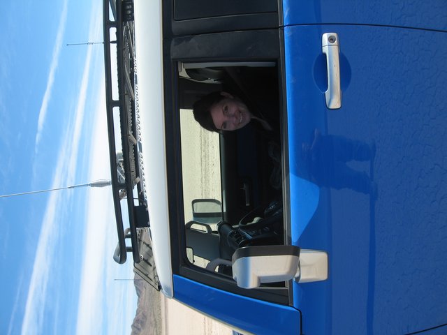 Smiling Woman in Blue Toyota FJ Cruiser Desert