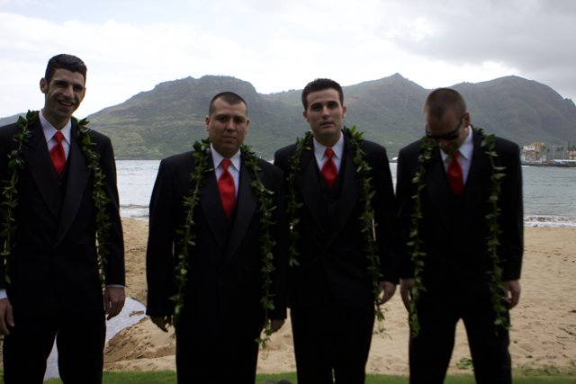 Four Men in Formal Wear on the Cloudy Beach