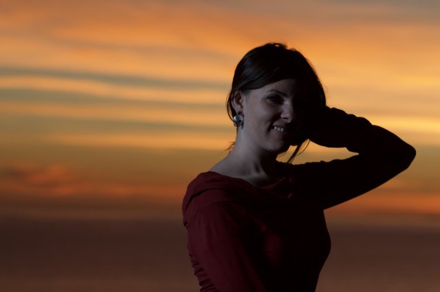 Silhouette Portrait Against a Fiery Sunset Sky