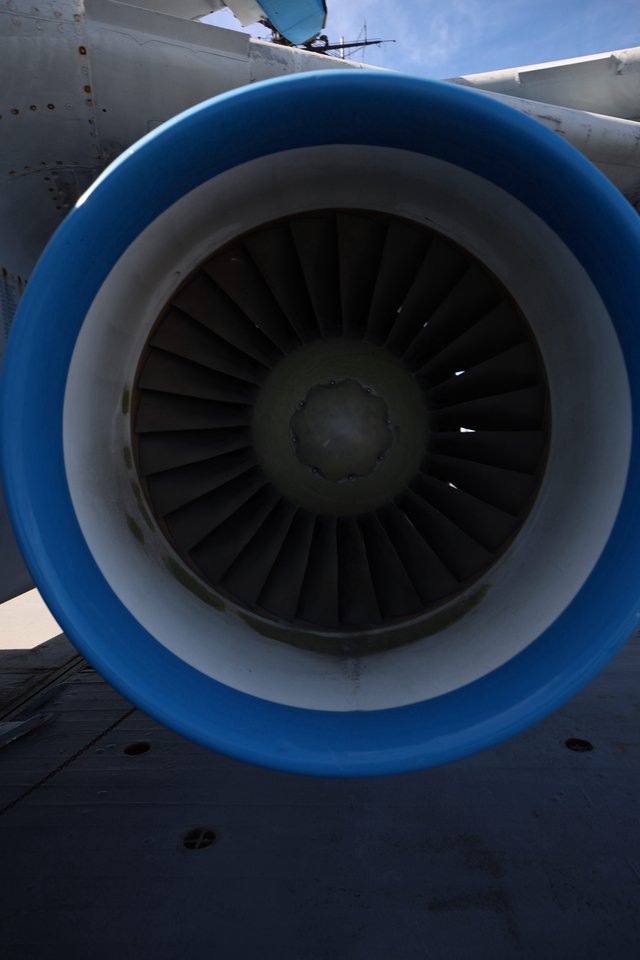 Close-Up View of Aircraft Jet Engine with Blue Cowling