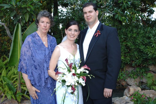Wedding Portrait with Mother and Newlyweds in Garden
