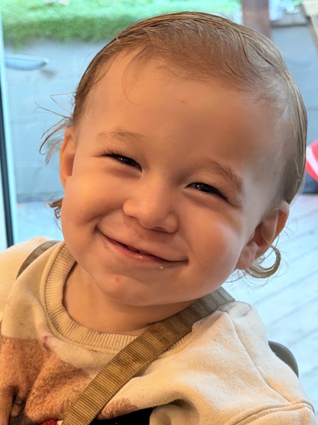 Joyful Toddler Portrait with Beaming Smile
