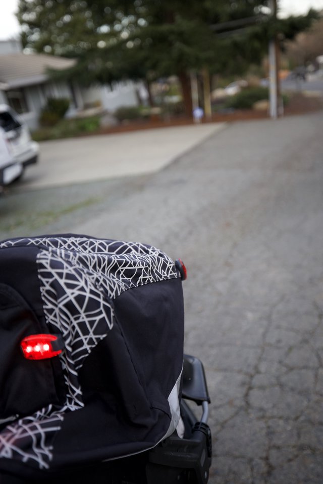 Evening Stroll with Baby Stroller in Suburban Neighborhood
