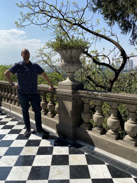 Man Standing on Balcony at Castillo de Chapultepec