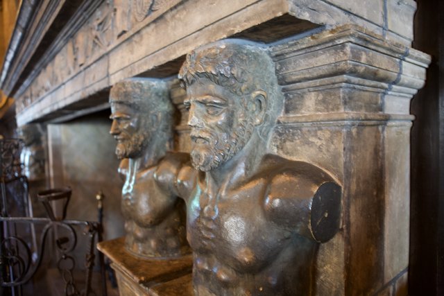 Bronze Men Adorn the Cryptic Wall
