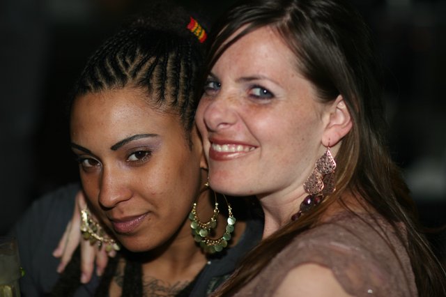 Two Friends Sharing a Joyful Moment at Night