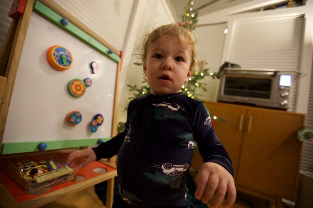 Toddler's Curious Christmas Morning in Kitchen