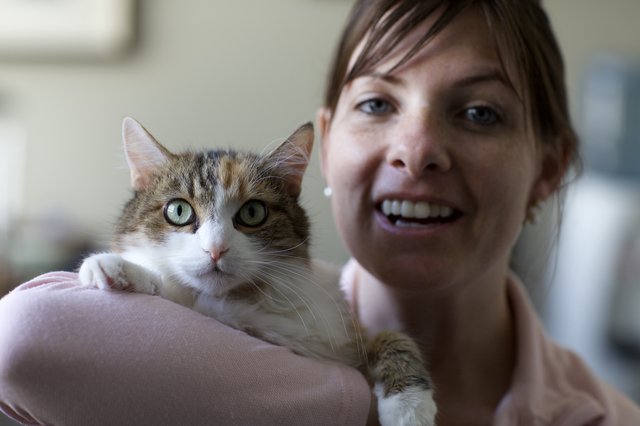 Woman and Tabby Cat Share a Joyful Moment