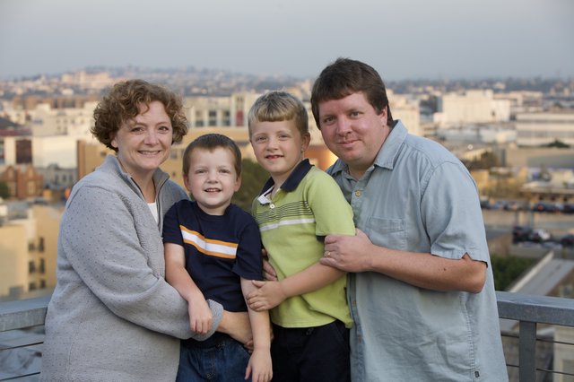 Family Portrait at Sunset on City Rooftop