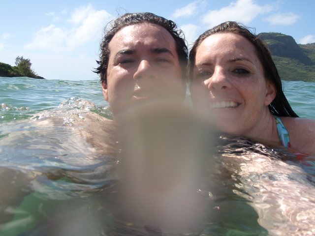 Couple Swimming in Hawaiian Ocean Waters Together